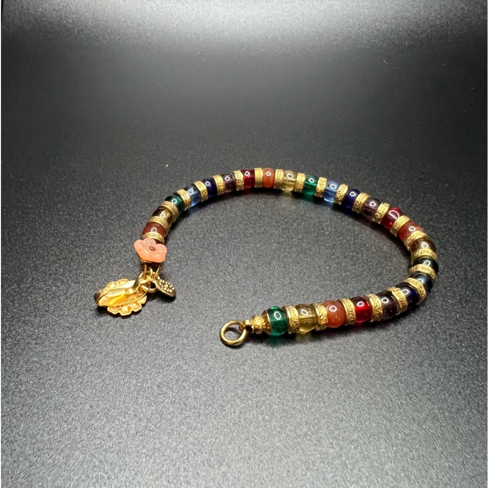 Good Pre owned condition Dexter Wilson bracelet stamped in gold tone